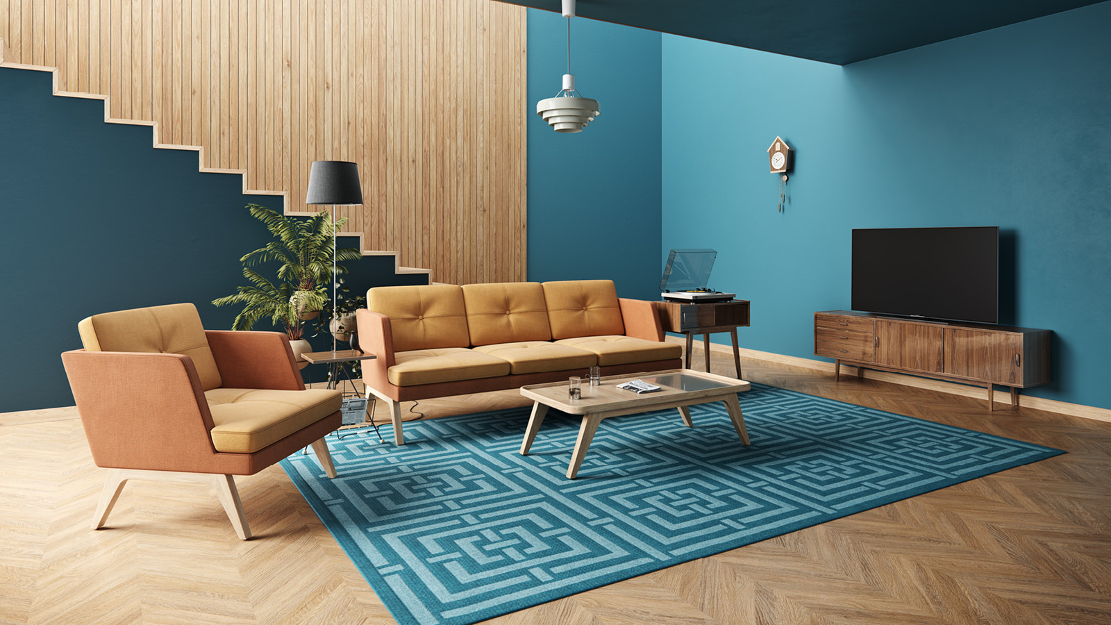 Domowy salon wyposażony w 3-osobową sofę oraz fotel w odcieniach żółto-pomarańczowych. Niebieski dywan uzupełnia aranżację.
